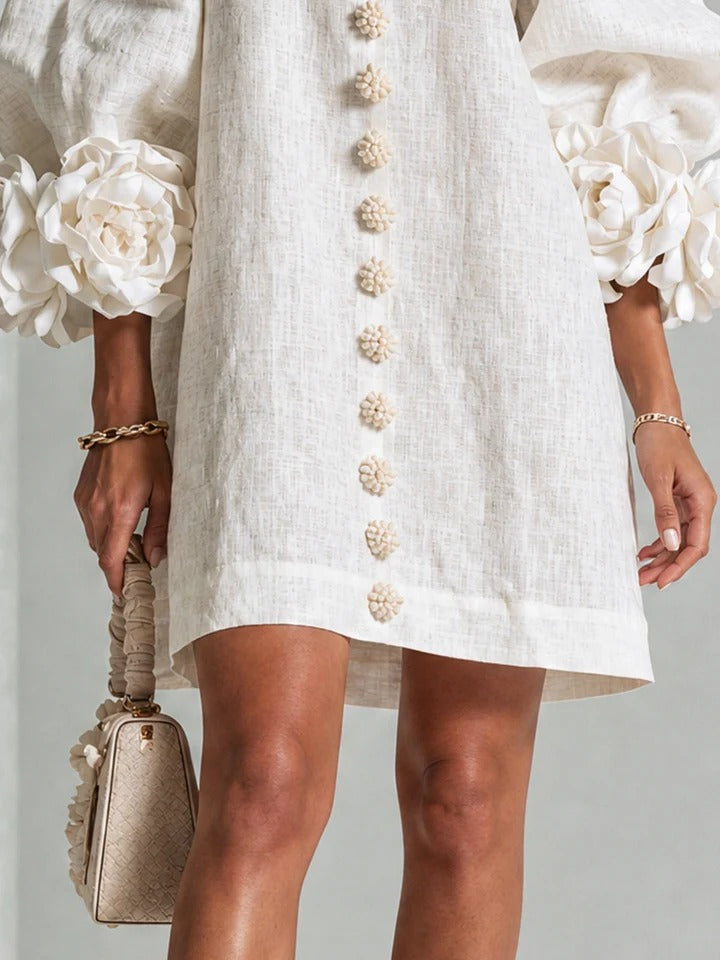 LOLA | MINIVESTIDO CON ESTAMPADO FLORAL Y CIERRE DE BOTONES